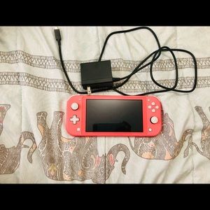Lightly used Nintendo switch lite; basically brand new. Comes with charger.